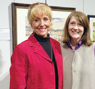 Charlotte and artists gathered near a Mid-Southern Watercolorists sign